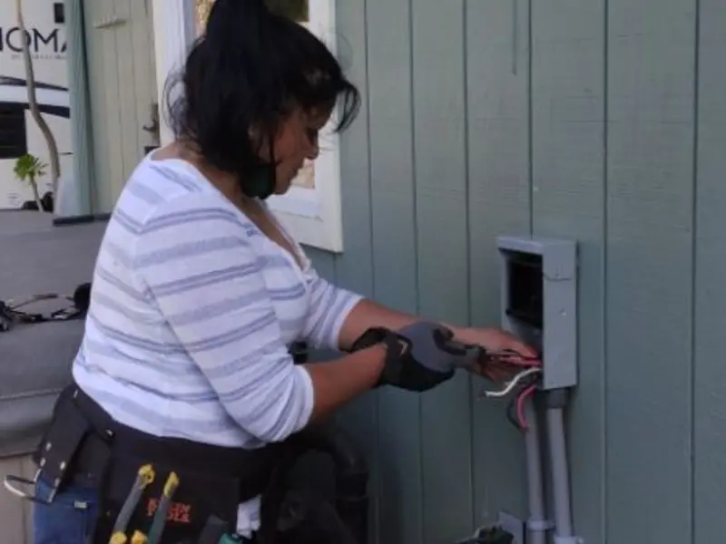 Licensed electrician wiring an exterior subpanel in Salem